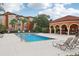 Community pool with adjacent covered area at 5500 Metrowest Blvd # 101, Orlando, FL 32811