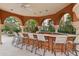 Poolside bar with seating for residents at 5500 Metrowest Blvd # 101, Orlando, FL 32811