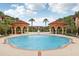 Resort-style pool with two gazebos and lounge chairs at 5500 Metrowest Blvd # 101, Orlando, FL 32811