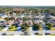 Aerial view of a residential neighborhood with houses and streets at 5649 Magnolia Bloom Ter, Oviedo, FL 32765