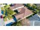 An aerial view of a charming house with a well-maintained yard at 5649 Magnolia Bloom Ter, Oviedo, FL 32765