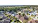 High-angle view of houses in a residential neighborhood with lush greenery at 5649 Magnolia Bloom Ter, Oviedo, FL 32765