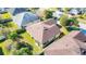 House and backyard, brown tile roof, fenced yard at 5649 Magnolia Bloom Ter, Oviedo, FL 32765