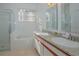 Bathroom with shower, bathtub, double vanity, and granite countertop at 5649 Magnolia Bloom Ter, Oviedo, FL 32765
