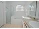 Bathroom with shower, bathtub, double vanity, and granite countertop at 5649 Magnolia Bloom Ter, Oviedo, FL 32765