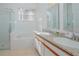 Bathroom with shower, bathtub, double vanity, and granite countertop at 5649 Magnolia Bloom Ter, Oviedo, FL 32765
