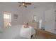 Well-lit bedroom featuring a dresser and ensuite bathroom at 5649 Magnolia Bloom Ter, Oviedo, FL 32765