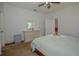 Serene bedroom with a dresser and access to a bathroom at 5649 Magnolia Bloom Ter, Oviedo, FL 32765
