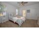 Bright bedroom with ceiling fan and ensuite bathroom access at 5649 Magnolia Bloom Ter, Oviedo, FL 32765