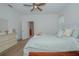 Comfortable bedroom with dresser and access to a bathroom at 5649 Magnolia Bloom Ter, Oviedo, FL 32765