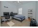 Bedroom with a single bed, workspace, and built-in shelving at 5649 Magnolia Bloom Ter, Oviedo, FL 32765