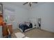 Bright bedroom with a double bed and ceiling fan at 5649 Magnolia Bloom Ter, Oviedo, FL 32765