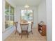 Bright breakfast nook with backyard views and a charming table setting at 5649 Magnolia Bloom Ter, Oviedo, FL 32765