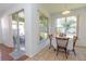 Breakfast nook with access to a patio and plenty of natural light at 5649 Magnolia Bloom Ter, Oviedo, FL 32765