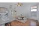 Elegant dining room, hardwood floors, and kitchen access at 5649 Magnolia Bloom Ter, Oviedo, FL 32765