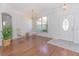 Bright dining room with hardwood floors, chandelier, and entryway view at 5649 Magnolia Bloom Ter, Oviedo, FL 32765