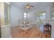 Bright dining room with hardwood floors and patio access at 5649 Magnolia Bloom Ter, Oviedo, FL 32765