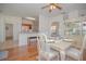 Open dining room with hardwood floors and kitchen views at 5649 Magnolia Bloom Ter, Oviedo, FL 32765