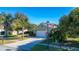 House exterior featuring a green facade and a white garage door at 5649 Magnolia Bloom Ter, Oviedo, FL 32765