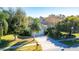 Single story house, green exterior, two car garage, landscaping at 5649 Magnolia Bloom Ter, Oviedo, FL 32765