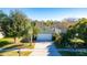 Single-story house, green exterior, two-car garage, landscaping at 5649 Magnolia Bloom Ter, Oviedo, FL 32765