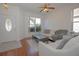 Living room with hardwood floors, comfy seating, and a coffee table at 5649 Magnolia Bloom Ter, Oviedo, FL 32765