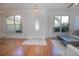 Bright living room featuring hardwood floors, a sofa, and a coffee table at 5649 Magnolia Bloom Ter, Oviedo, FL 32765