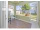 Relaxing screened porch with rocking chairs and tiled floor at 5649 Magnolia Bloom Ter, Oviedo, FL 32765