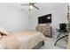 Spacious bedroom with large TV, dresser, and comfortable bedding at 6011 W Town Center Blvd, Orlando, FL 32837