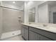 Modern bathroom with double vanity and shower at 640 Reggie Rd, Winter Haven, FL 33884