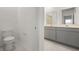 Clean bathroom with gray vanity, double sinks and a shower at 640 Reggie Rd, Winter Haven, FL 33884