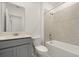 Clean bathroom with tub and gray vanity at 640 Reggie Rd, Winter Haven, FL 33884