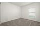 Bright bedroom featuring neutral wall and carpet at 640 Reggie Rd, Winter Haven, FL 33884