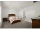 Cozy bedroom with carpeted floors and a floral bedding set at 640 Reggie Rd, Winter Haven, FL 33884