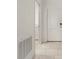 Bright hallway with tile floors and laundry access at 640 Reggie Rd, Winter Haven, FL 33884