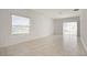 Bright and airy living room with tile floors and sliding glass doors at 640 Reggie Rd, Winter Haven, FL 33884
