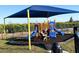Community playground with shaded play area and playground equipment at 640 Reggie Rd, Winter Haven, FL 33884