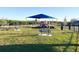 Community playground with shaded play area and benches at 640 Reggie Rd, Winter Haven, FL 33884