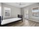 Bedroom with lots of light, wood-look floors, and a ceiling fan at 718 N Grandview Ave, Daytona Beach, FL 32118