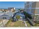 Charming beach home featuring a well-kept lawn, mature palm trees, and a paved walkway leading to the entrance at 718 N Grandview Ave, Daytona Beach, FL 32118