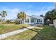 Inviting single-Gathering home with a well-manicured lawn and a paved walkway leading to the front entrance at 718 N Grandview Ave, Daytona Beach, FL 32118