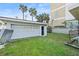 The detached garage features a door for entry, and a full garage door at 718 N Grandview Ave, Daytona Beach, FL 32118