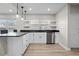 Bright kitchen features wood floors, granite counters, and white cabinets at 718 N Grandview Ave, Daytona Beach, FL 32118