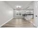Open concept kitchen features wood floors, pendant lights, and breakfast bar at 718 N Grandview Ave, Daytona Beach, FL 32118