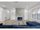 Living room features wood floors, fireplace, neutral walls, and large windows at 718 N Grandview Ave, Daytona Beach, FL 32118