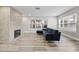 Living room with wood floors, fireplace, neutral walls, and plenty of natural light at 718 N Grandview Ave, Daytona Beach, FL 32118