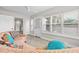 Bright living room with neutral wall paint, modern flooring, and an orange couch, creating a cozy atmosphere at 718 N Grandview Ave, Daytona Beach, FL 32118