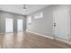 Bright living room features wood floors, neutral walls, recessed lights, and a modern ceiling fan at 718 N Grandview Ave, Daytona Beach, FL 32118