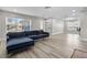 Open living room features wood floors, neutral walls, recessed lights, and natural light at 718 N Grandview Ave, Daytona Beach, FL 32118