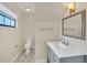 Bathroom featuring a vanity with marble countertop, stylish mirror, and tile floors at 7760 Windbreak Rd, Orlando, FL 32819
